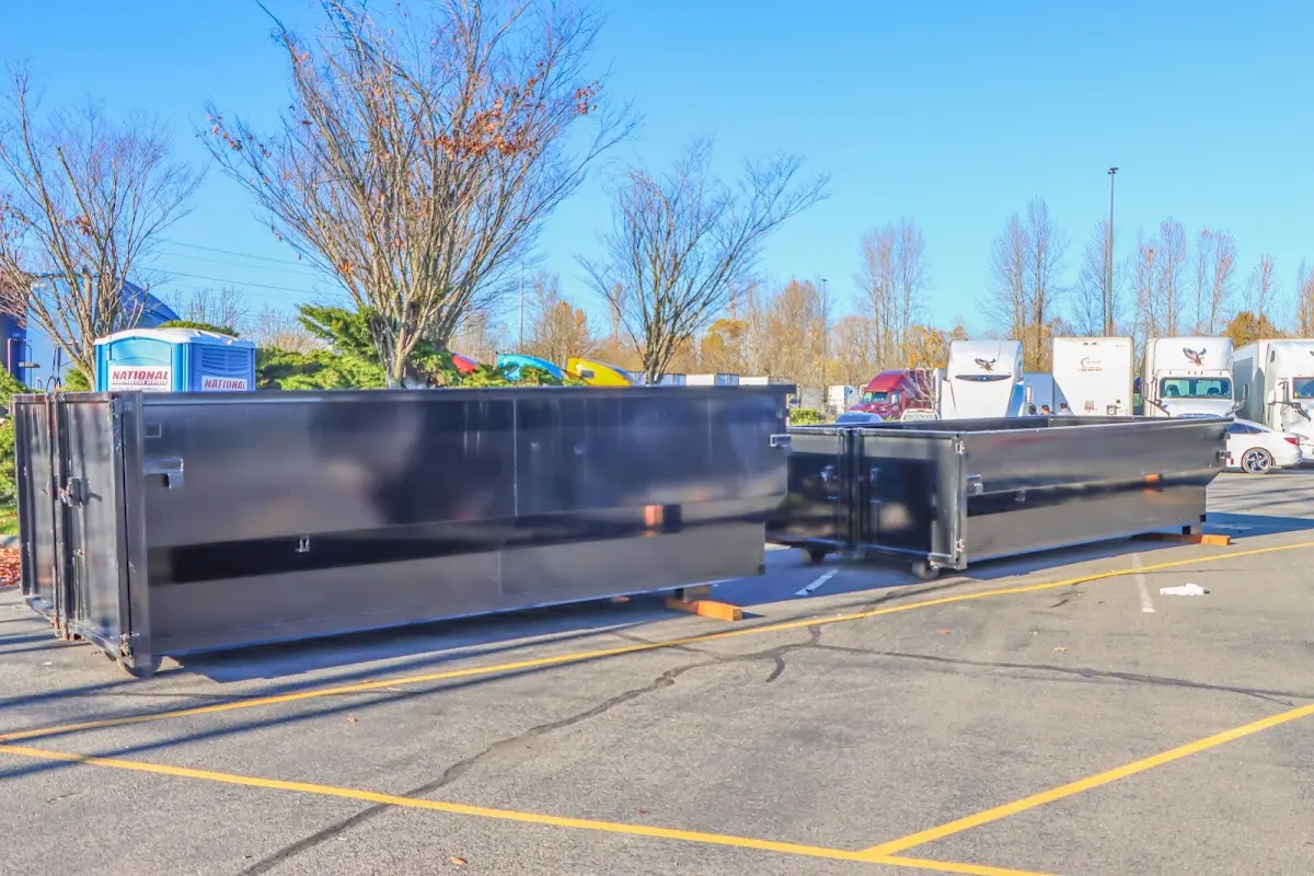Professional dumpster rental service with roll-off container on residential driveway in Saddlebrooke